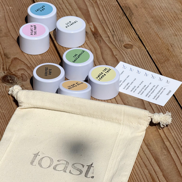 cotton drawstring bag with 7 mini toast candles inside